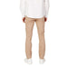 Armani Exchange Men Trousers in beige paired with a white shirt and white shoes