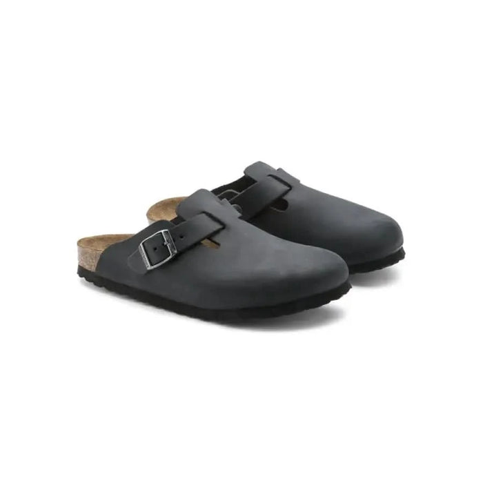 Birkenstock women sandals: black leather clogs with buckle straps and cork footbeds