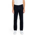 Jeckerson Men’s Trousers: Black straight-leg jeans with white sneakers and white top