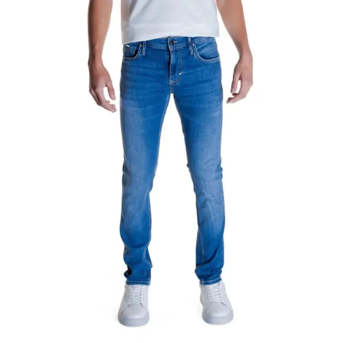 Pair of blue denim jeans worn by a person featuring Antony Morato branding