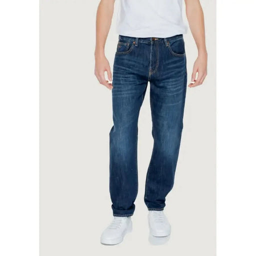 Pair of blue denim jeans worn by a person from Armani Exchange Men Jeans collection