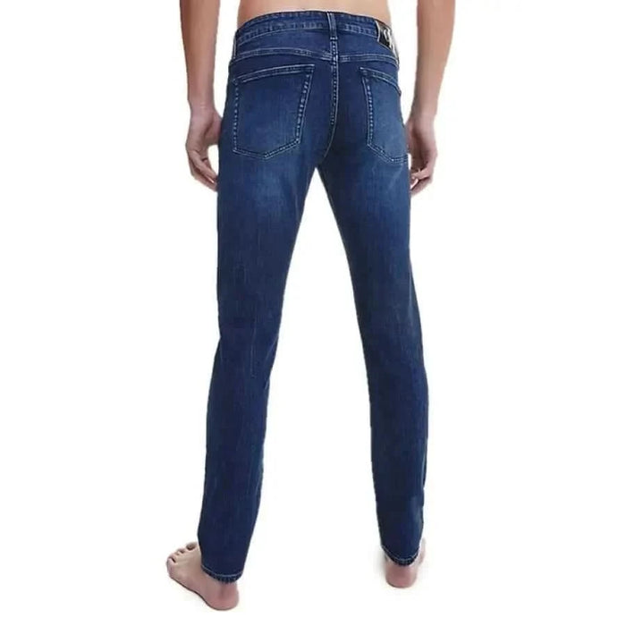 Blue denim jeans back view from Calvin Klein Jeans product line for men