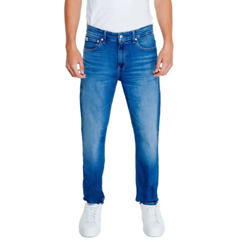 Pair of blue straight-leg fit denim jeans by Calvin Klein Jeans for men