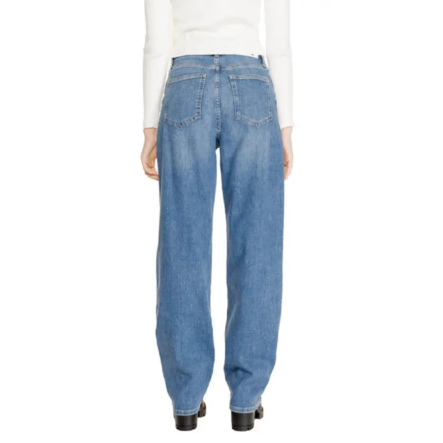 Back view of loose-fitting blue denim Calvin Klein Women’s Jeans