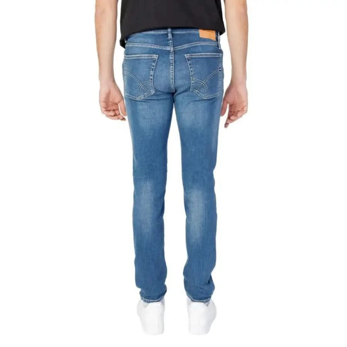 Blue denim jeans by Gas, worn by a person from the waist down