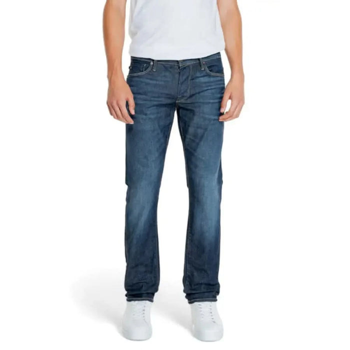 Pair of blue denim jeans styled with a white shirt and shoes from Jack & Jones