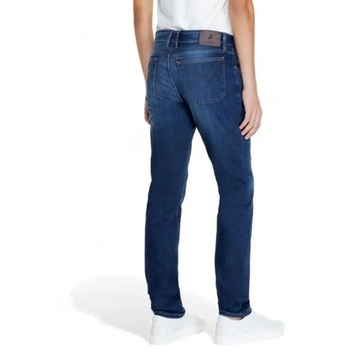 Jeckerson Men Trousers: Blue denim jeans worn by standing person