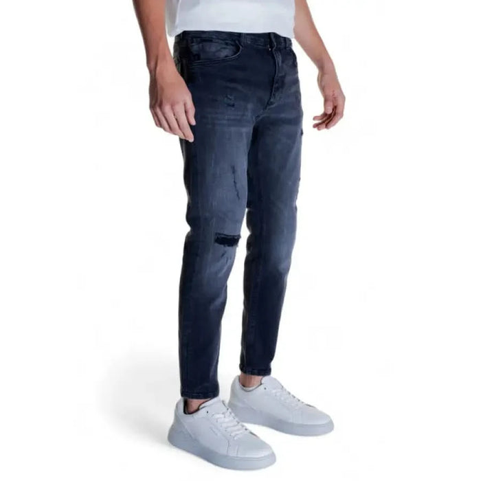 Dark blue distressed skinny jeans with knee rip from Antony Morato Men Jeans collection