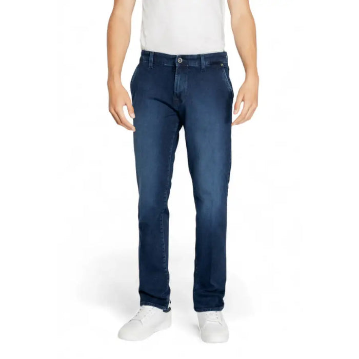 Dark blue Gas Men Jeans styled with white sneakers for a casual look