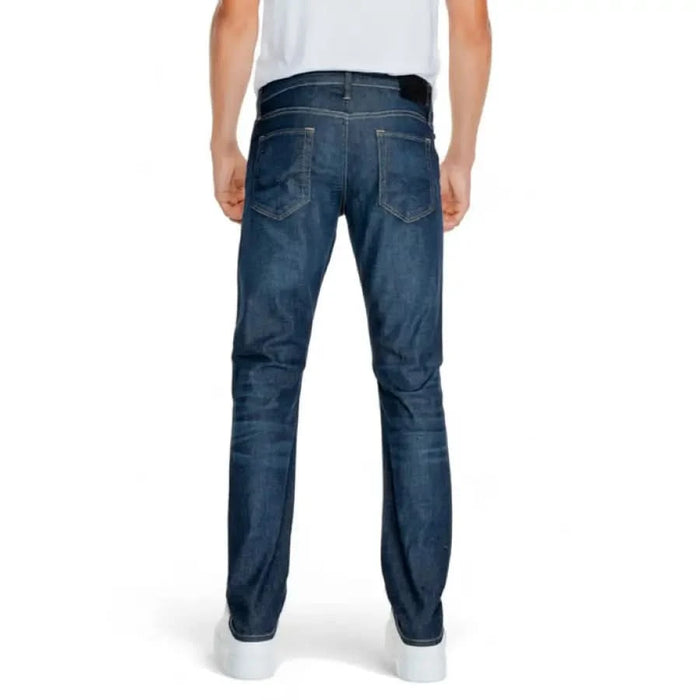 Dark blue denim jeans viewed from the back by Jack & Jones for men