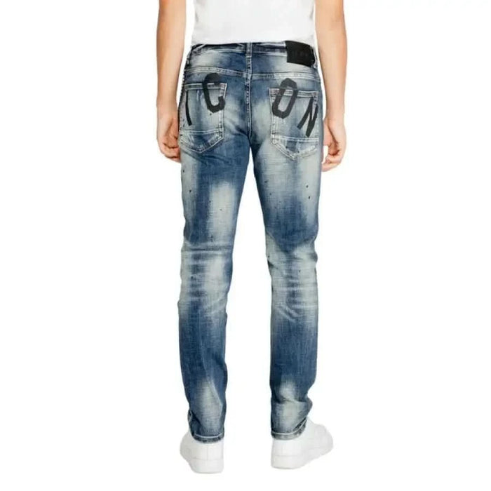 Pair of distressed blue jeans with decorative patches on Icon Men Jeans back pockets