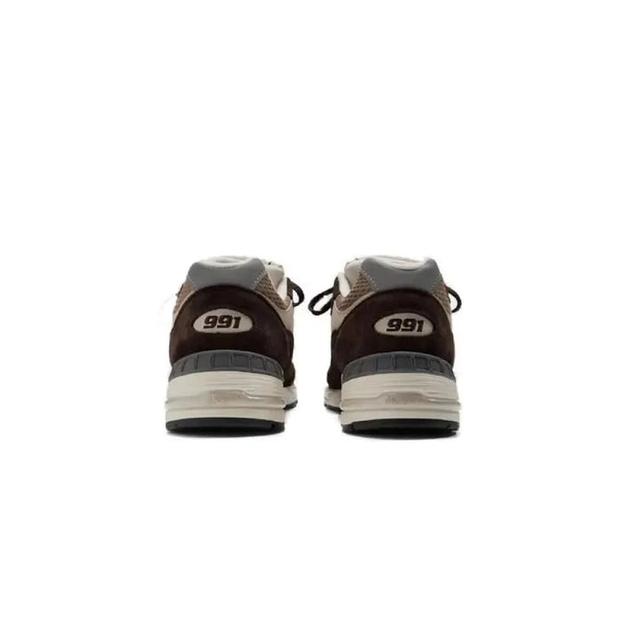 Pair of gray and brown New Balance 991 sneakers viewed from the back. New Balance Men Sneakers