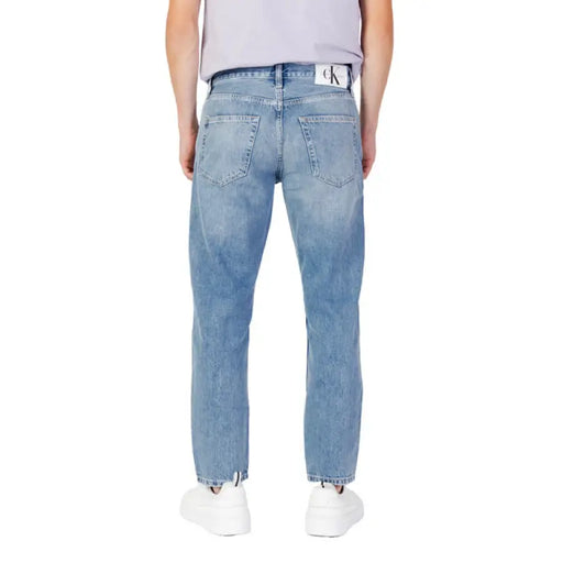 Light blue straight leg denim jeans with back pockets by Calvin Klein Jeans