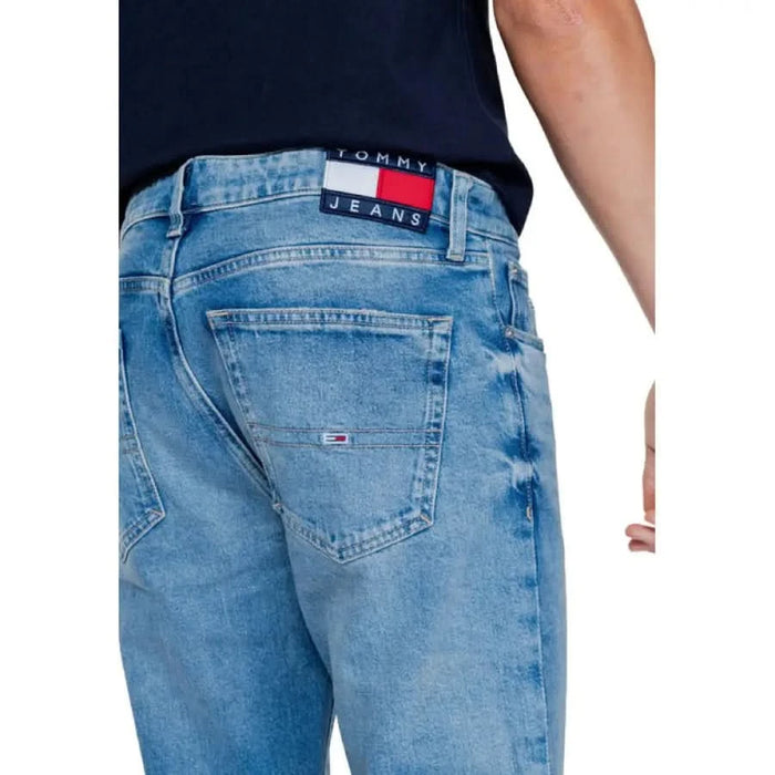 Light blue Tommy Hilfiger jeans featuring back pocket and brand logo