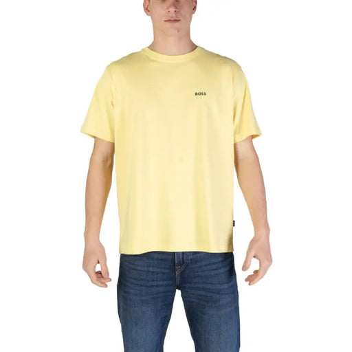 Pale yellow Boss Men T-Shirt paired with blue jeans showcasing stylish text detail