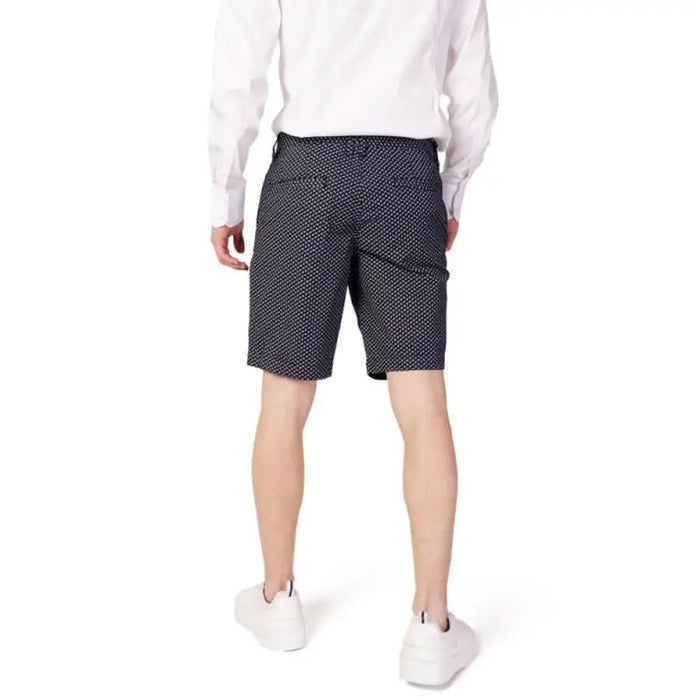 Armani Exchange Men Shorts with white shirt above waistband showcasing stylish dark patterns