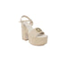 Person in beige suede showcasing Guess Women Sandals from Guess Guess collection