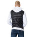 Man in white hoodie, black puffy vest, and blue jeans showcasing Ea7 Men Gilet