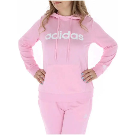 Person wearing Pink Adidas hoodie from Adidas - Adidas Women Sweatshirts collection