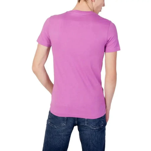 Calvin Klein Jeans Men T-Shirt in pink short-sleeved worn with blue jeans