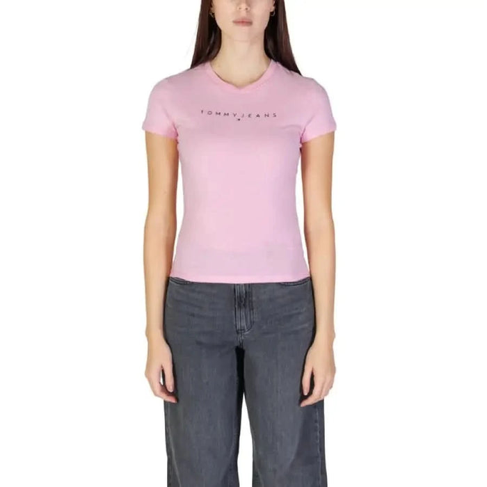 Pink Tommy Jeans t-shirt with gray denim pants from Tommy Hilfiger Jeans collection