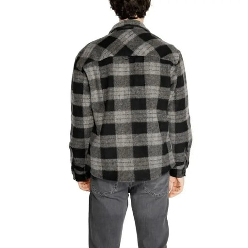 Plaid flannel jacket worn by a model from behind, featured in Jack & Jones Men Shirt