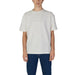 Plain white crew neck t-shirt paired with blue jeans from Calvin Klein Jeans