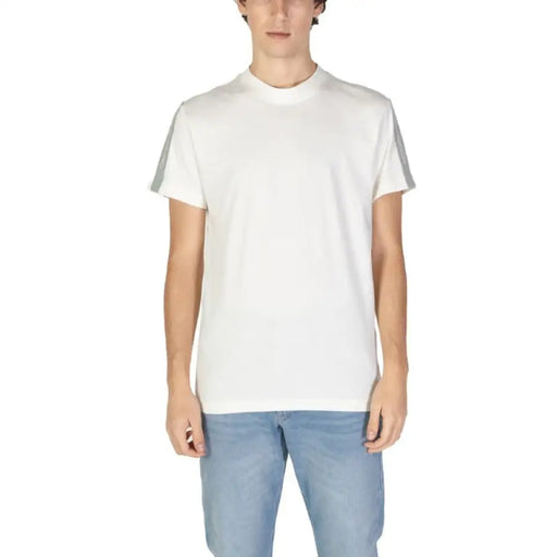 Plain white crew neck t-shirt paired with light blue jeans from Calvin Klein Jeans