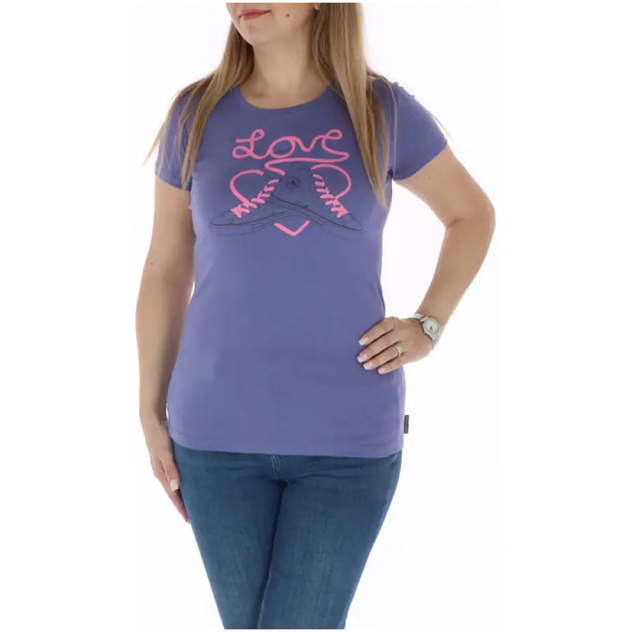 Purple ’Love’ t-shirt with heart design and pink sneakers, part of the Converse Women T-Shirt