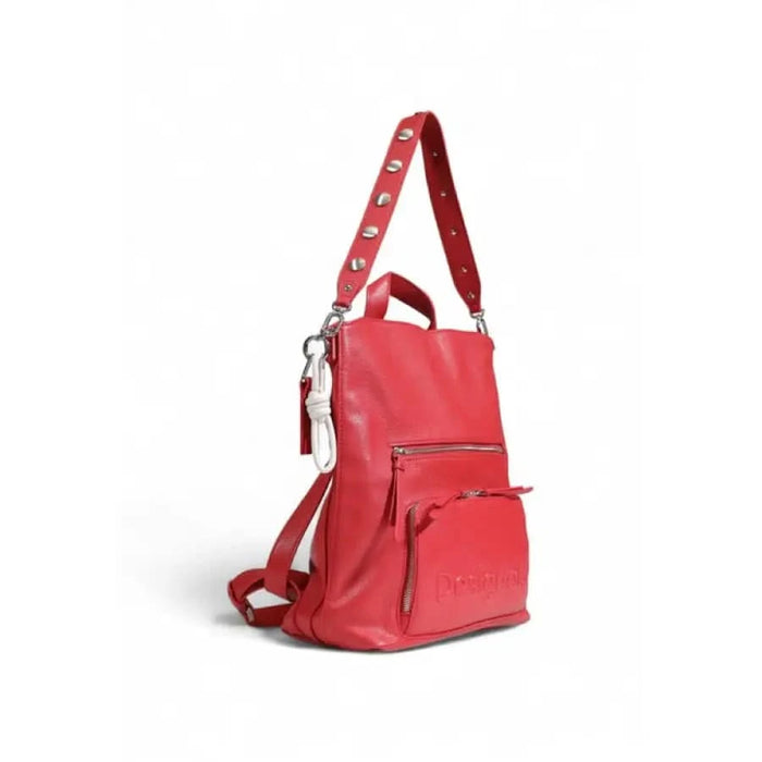 Red leather backpack by Desigual featuring zippered compartments and adjustable straps