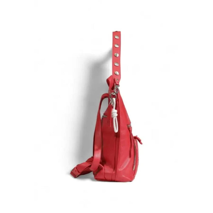 Red leather handbag with studded strap and zipper closure by Desigual