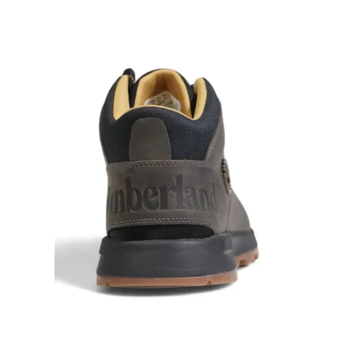 Rugged dark gray Timberland men’s sneaker featuring prominent logo on heel