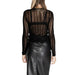 Sheer black long-sleeved top over a black undergarment with leather skirt from Vila Clothes