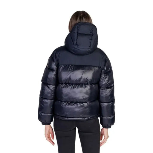 Shiny black puffer jacket with hood displayed from the back by Napapijri Women Jacket