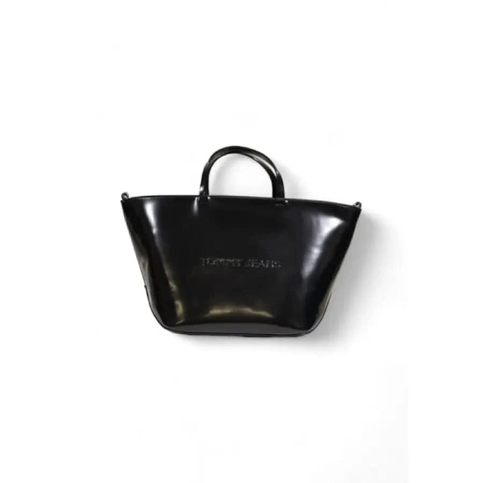 Sleek black leather trapezoidal handbag by Tommy Hilfiger with short handles