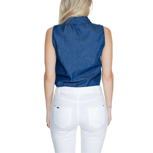 Sleeveless blue denim shirt with white pants, back view - Jacqueline De Yong Women’s Shirt