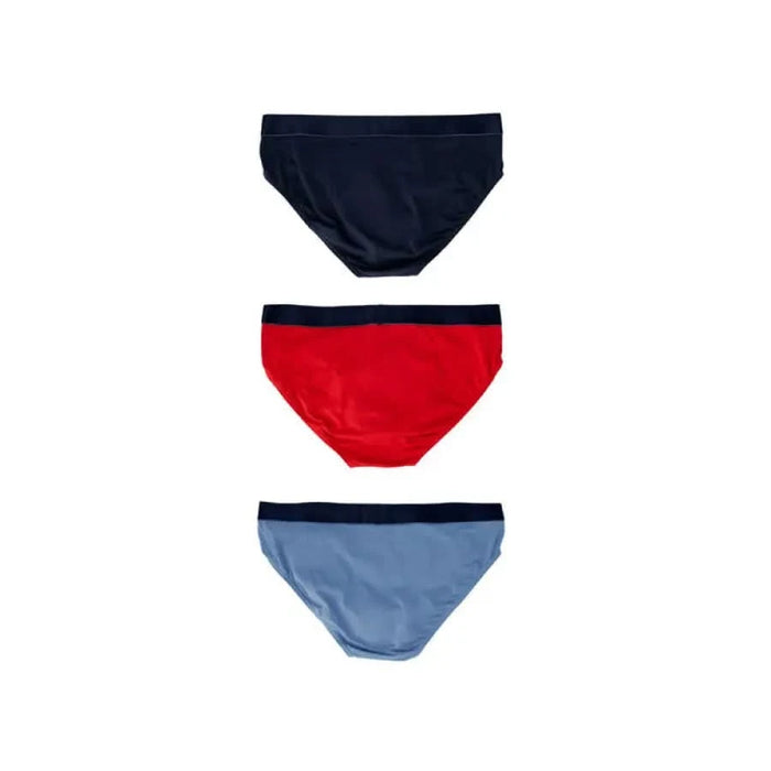 Three pairs of Emporio Armani men’s briefs in navy, red, and light blue colors