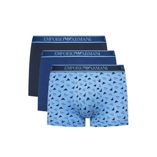 Three pairs of Emporio Armani men’s boxer briefs in blue, including a patterned pair