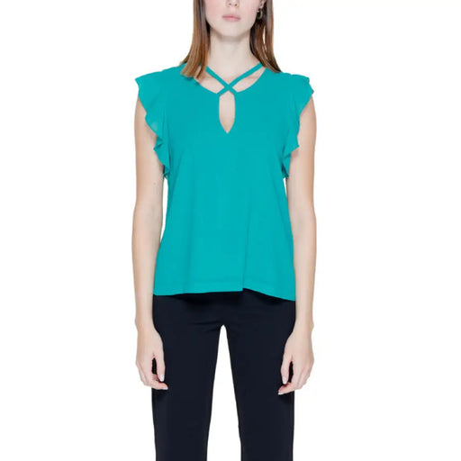 Turquoise sleeveless blouse with ruffled cap sleeves and crisscross neckline detail