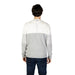 Two-toned Antony Morato sweater in white and grey paired with dark jeans for men