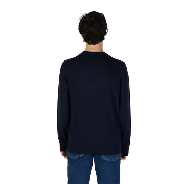 Back view of a person in a black sweater and blue jeans wearing Gas Men Cashmere Cotton Sweater