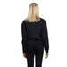 Back view of blonde person in black sweater and pants, Armani Exchange Women Sweatshirts