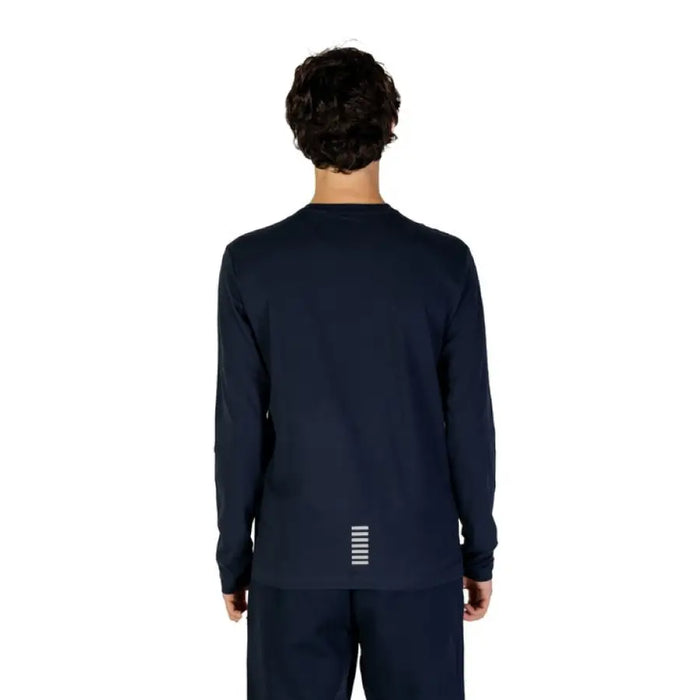 Back view of a person wearing a navy blue long-sleeved sweater from Ea7