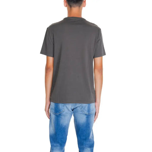 Back view of a dark gray Armani Exchange men t-shirt with blue jeans