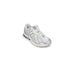 White New Balance running shoe with silver accents from New Balance Women Sneakers collection