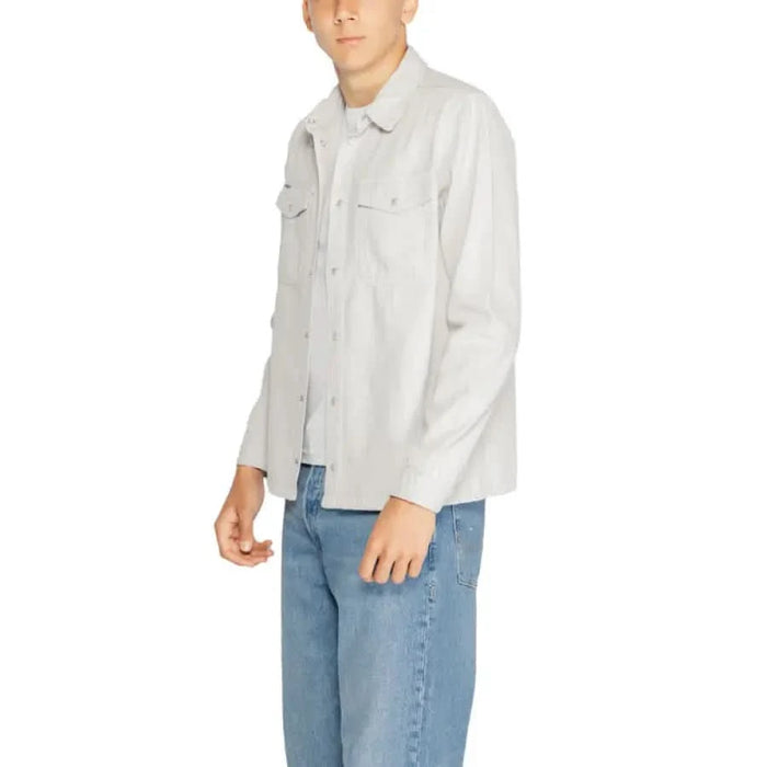 Antony Morato Men Shirt in white with chest pockets, styled with blue jeans