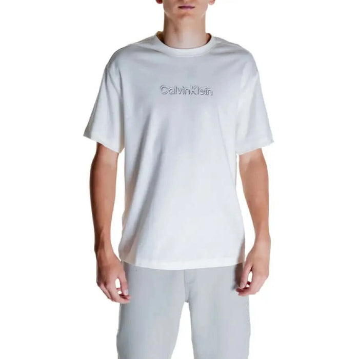 White Calvin Klein Men T-Shirt with embossed logo worn by a person