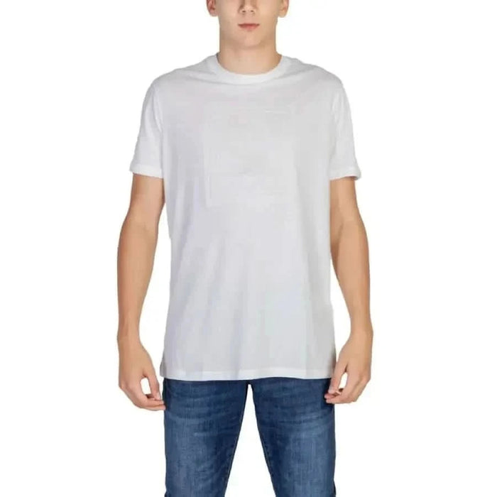 White crew neck t-shirt worn by a person featuring Armani Exchange Men branding