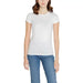 White crew neck T-shirt worn by a woman paired with blue jeans from Armani Exchange