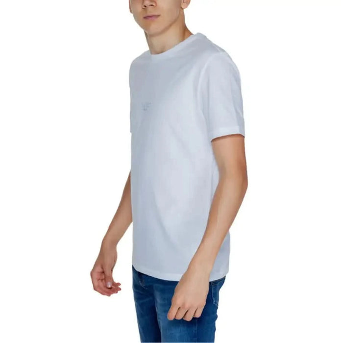 Guess Men T-Shirt White Crew Neck worn by young man with Blue Jeans